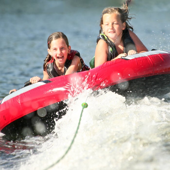kids tubing on lake