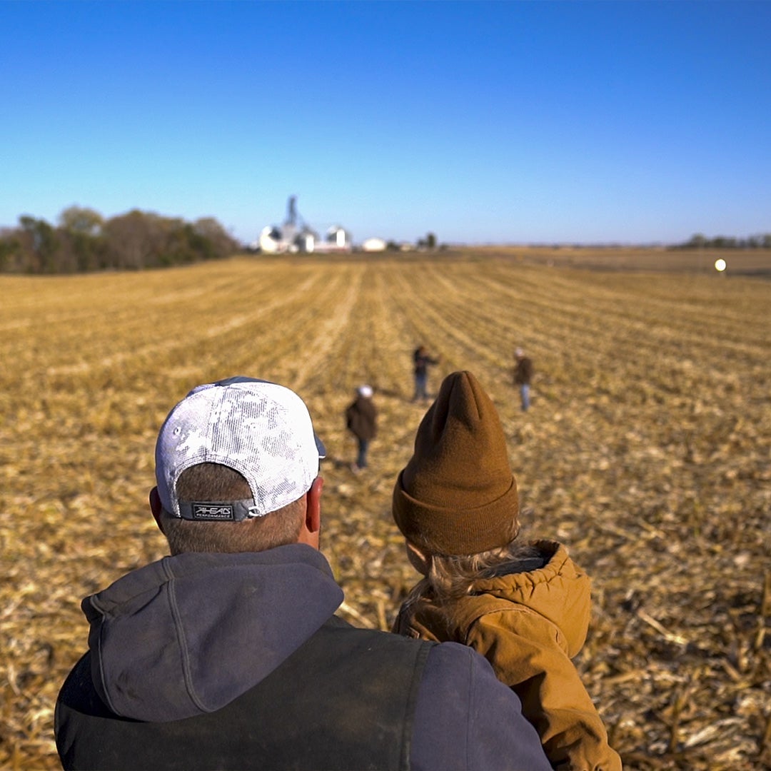 Member and Child In Field