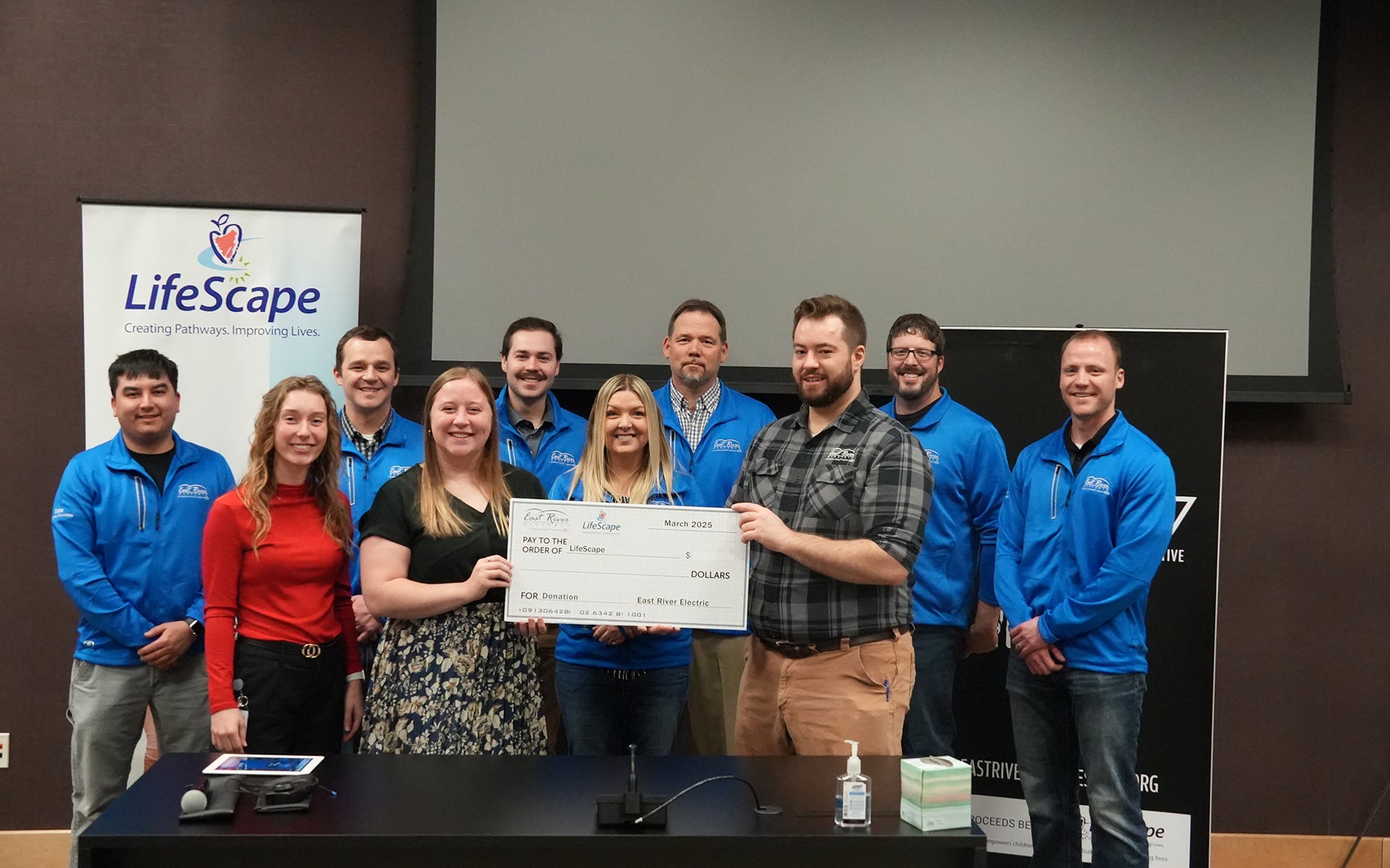 Employees committee presents check to Lifescape