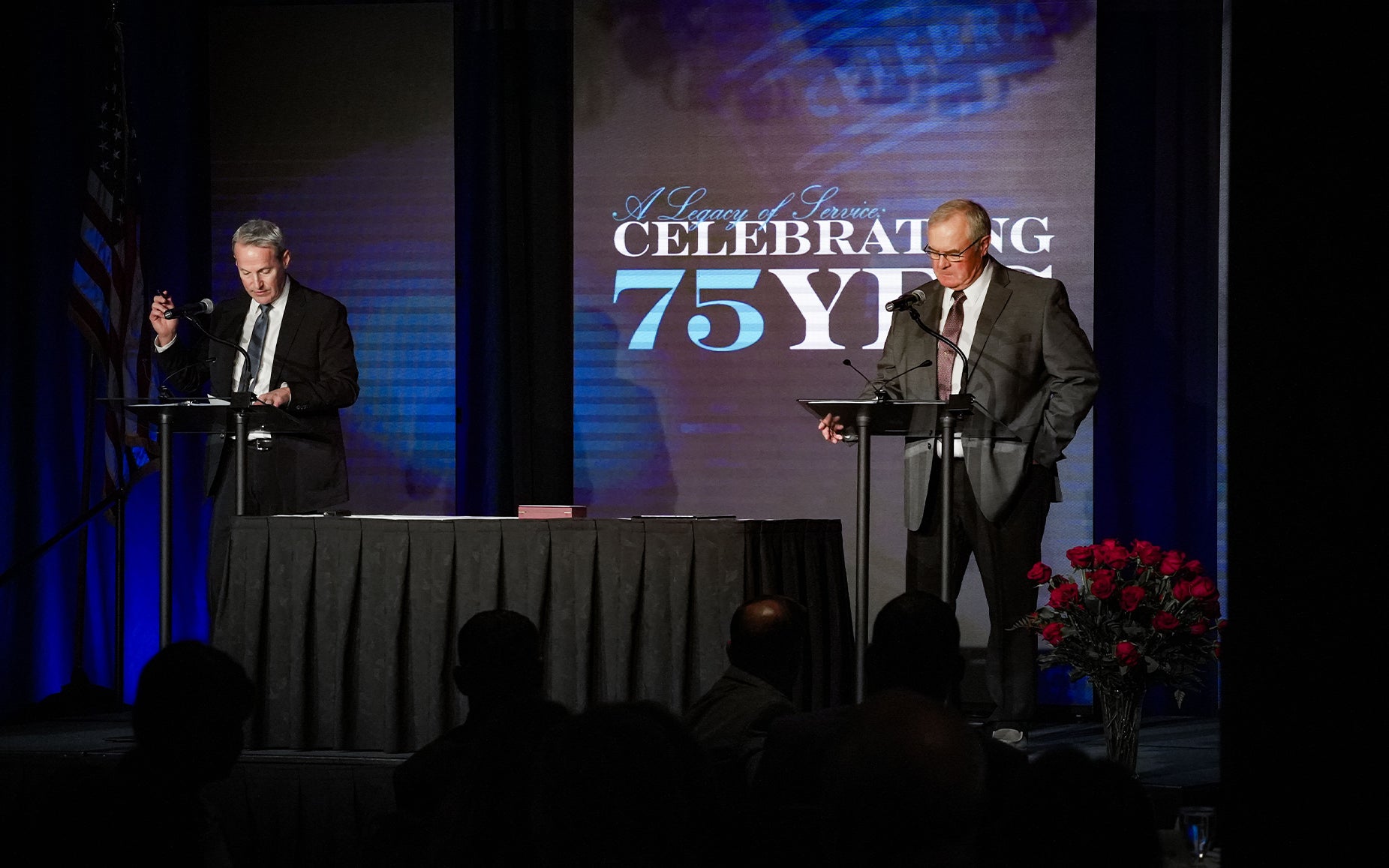 East River General Manager Bob Sahr and President Alan Vedvei stand on stage